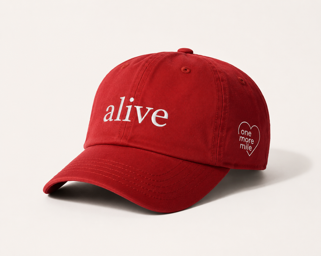 Red cap with 'alive' text on a white background